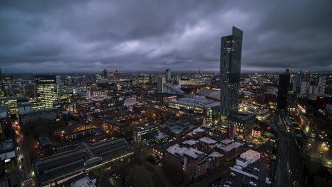 Establishing Bird Eye Aerial View Shot of Manchester City UK Skyline England United Kingdom at evening night drone helicopter