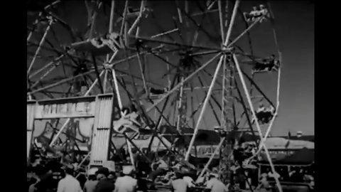 CIRCA 1951 - Many kinds of rides and attractions are shown at the amusement park section of the New York State Fair.