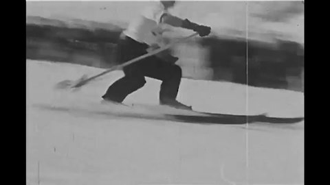 CIRCA 1935 - Spectators enjoy a men's slalom race at Mount Rainier.