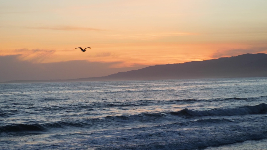 Slow motion shot of sunset at beach in Los Angeles, California