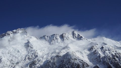Mount Cook's peak covered by snow during sunny day.