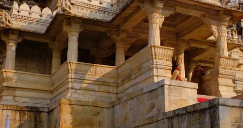 RANAKPUR, INDIA - NOVEMBER 12, 2019: Exterior of beautiful Ranakpur Jain temple or Chaturmukha Dharana Vihara. Marble medieval sculpture carvings of sacred place of jainism. Ranakpur, Rajasthan. India