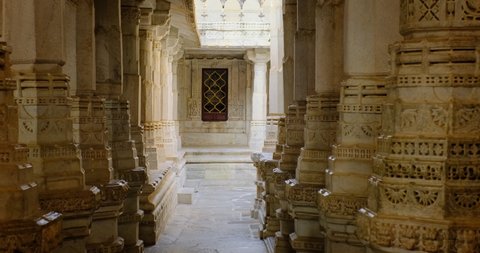 Inside the sacred Ranakpur Jain temple or Chaturmukha Dharana Vihara. Marble ancient medieval carved sculpture carvings of sacred religious place of jainism worship. Ranakpur, Rajasthan. India