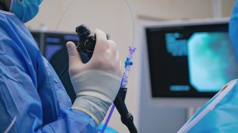 VINNITSA, UKRAINE - September 2019: Doctor endoscopist at work in hospital room. Doctor at the endoscopy process in the hospital room