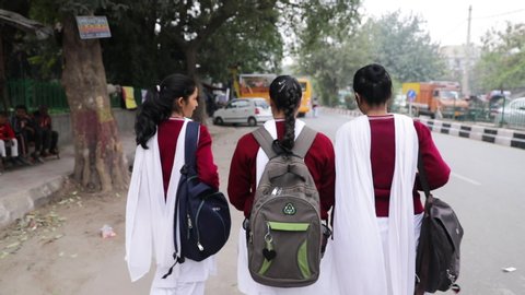 Rajouri Garden_Delhi_India_Feb_12_2019: Indian School Girls Going back to home from School with School bags, Delhi, India