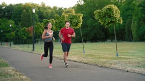 Young couple jogging together in the park