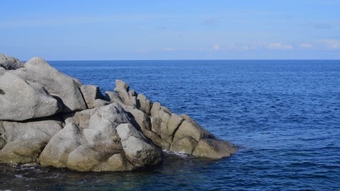 Coti Piane, the cliffs of Capo Sant'Andrea in Elba island, Tuscan Archipelago, Italy. Large granite massifs mixed with orthoclase crystals surrounded by beautiful sea water