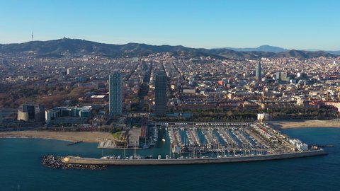 Aerial view of the Olympic harbour in Barcelona Spain sunny day leisure boats Sagrada Familia in background