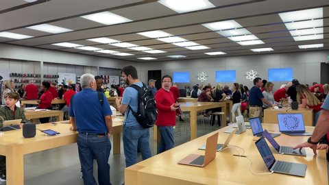 Orlando, FL/USA-12/6/19: An Apple store with people waiting to purchase Apple Macbooks, iPads and iPhones.
