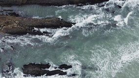 Aerial view to ocean waves. Blue water background. Video made from above by drone.