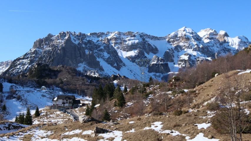 Italian Pre-Alps view with snowcapped mountain range in Recoaro, Italy 