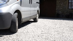 Tradesman gets tool box out of his van. The handyman is outside, wearing a tool belt as he gets to his vehicle - Powered by Shutterstock - Get 15% off with code: PIKWIZARD15