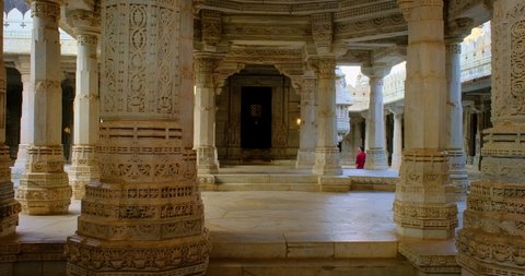 Columns of beautiful Ranakpur Jain temple or Chaturmukha Dharana Vihara. Marble ancient medieval carved sculpture carvings of sacred religious place of jainism worship. Ranakpur, Rajasthan. India