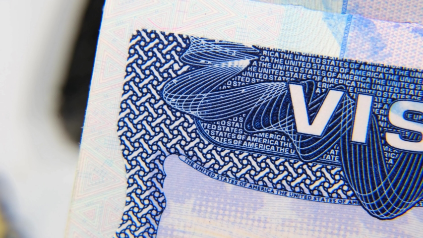 The United States entry visa sticker in a passport. Slow panning. Close up view video footage. Royalty-Free Stock Footage #1044320698