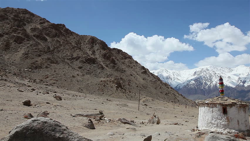 View of stupas and snow mountain in the valley of Leh