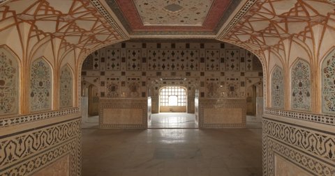 Details of an intricate walls interior of the famous tourist landmark Sheesh Mahal or Mirror Palace. Inside Amer Fort, Amer, Rajasthan, India