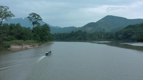 Aerial view of mountains and river Nong Khiaw. North Laos. Southeast Asia. Video made by drone from above. Bird eye view.