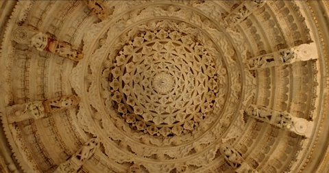 Ceiling of iconic Ranakpur Jain temple or Chaturmukha Dharana Vihara. Marble ancient medieval carved sculpture carvings of sacred religious place of jainism worship. Ranakpur, Rajasthan. India