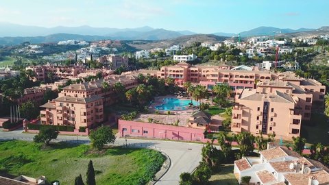 Estepona, Malaga / SPAIN - January 05 2020: Aerial view of Luxury Urbanisation and Hotels in famous area Bel-Air Estepona-Marbella. Sierra Blanca Mountains. Beautiful Andalusian Architecture.Drone Up