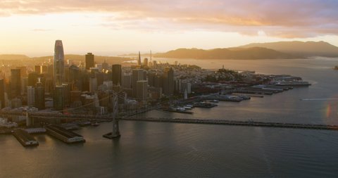 Amazing aerial view of the San Francisco Oakland Bay Bridge sunset. Yerba buena and Treasure Island in the background. Interstate 80. California, USA. Shot on Red weapon 8K.