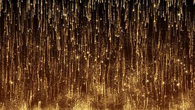 This motion graphics video shows gold particles falling and re-taking off, sparkling against a dark background in a spectacular light show.