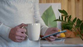 A man drinks coffee in the morning, uses a smartphone - Powered by Shutterstock - Get 15% off with code: PIKWIZARD15