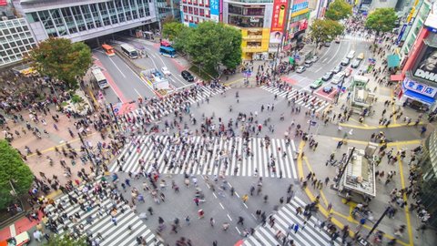 Tokyo Japan 3 Nov 2019: Aerial time lapse view over Shibuya crossing with many pedestrians and vehicles crossing the junction in Tokyo Japan at day time. Shibuya fashion shopping entertainment concept