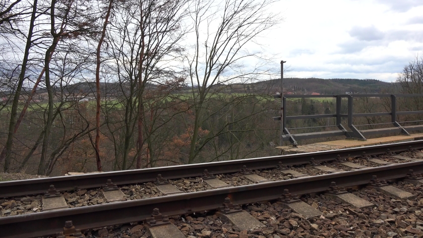 Close view of railing in nature, on a bridge.