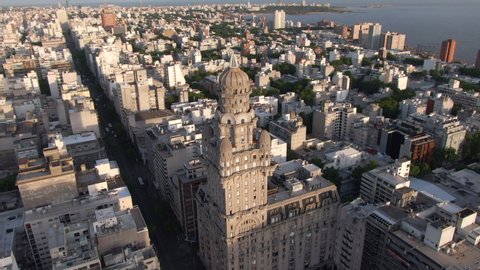 Aerial view of Montevideo cityscape showing historical landmark Palacio Salvo in the Old City at sunset in Montevideo, Uruguay.