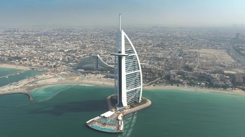DUBAI, UNITED ARAB EMIRATES - JANUARY 2, 2020. Aerial shot of the Burj Al Arab and the Jumeirah Beach Hotel luxury hotels