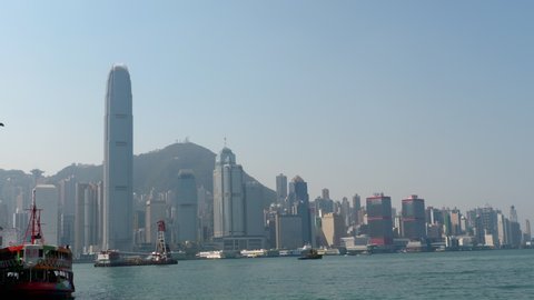 HONG KONG - NOVEMBER 8, 2019: Star Cruises Pisces docked at Victoria Harbor, Hong Kong skyline panorama