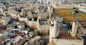 Picturesque autumn landscape of Olite with imposing medieval Palace of Kings of Navarre, Spain