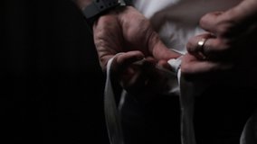 Young Stylish Chef. He Is Getting Ready For Work. Guy Puts On White Apron. Face Invisible. - Powered by Shutterstock - Get 15% off with code: PIKWIZARD15