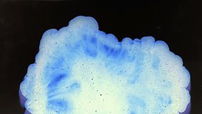 Abstract smoke flow. Mysterious glow. White blue dusty cloud motion on dark background.