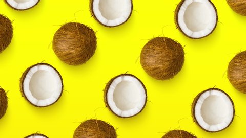 Animated diagonal coconut pattern on yellow background. Minimal flat layout style. Top down view. Pop art design, creative summer food concept. 