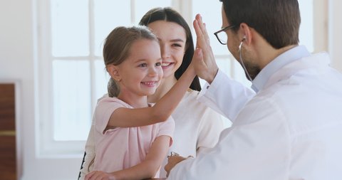 Male pediatrician hold stethoscope exam cute little child girl patient visit doctor with mom, paediatrician listen kid heartbeat do pediatric checkup in hospital, children medical health care concept