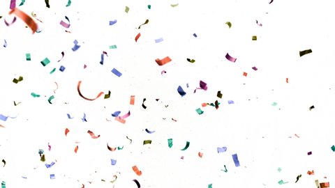Super slow motion of flying coloured confetti isolated on white background. Filmed on high speed cinema camera.