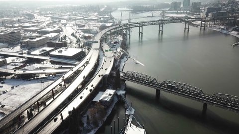 A time lapse footage of busy traffics on the bridges and highways in the sunshine after snow falls