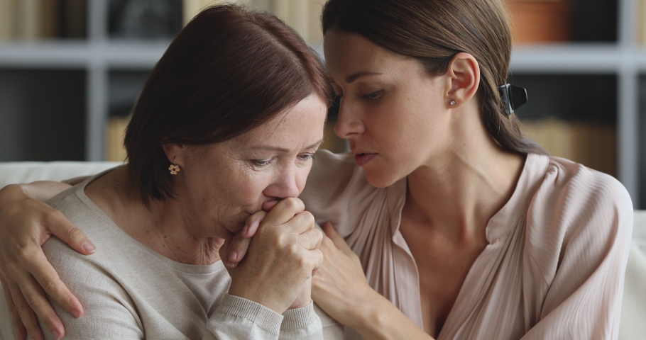 Caring worried guilty young adult daughter apologizing comforting sad depressed old mother say sorry feel pity regret consoling upset senior mom ask for forgiveness hug giving empathy support concept Royalty-Free Stock Footage #1044454891