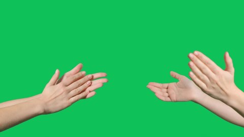 Hands are clapping on green screen background. Female hands silhouette clapping on a chroma key background