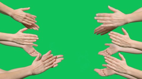 Hands are clapping on green screen background. Female hands silhouette clapping on a chroma key background