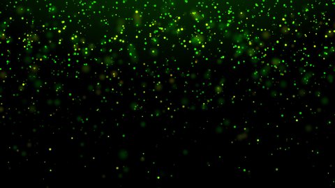 A looped motion background of falling emerald-green and gold sparkling particles. For St. Patrick's day. For Wallpapers, greetings, screensavers. Bright green and gold color, bokeh effect. Video de stock
