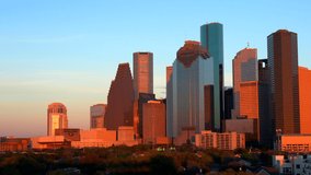 High rise buildings in Houston cityscape illuminated at sunset, Texas, United States, Texas, United States