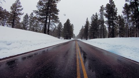 timelapse road journey in snow storm down highway 12 through Bryce National park