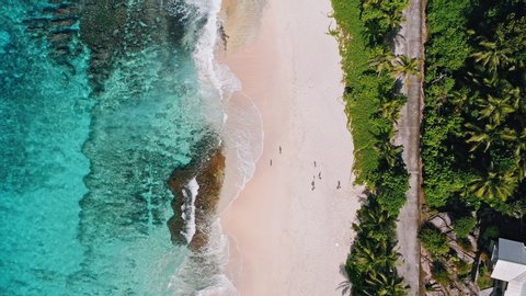 Mahe island, Seychelles.. Aerial top down view of tropical beach Anse Bazarca. Summer vacation, travel and lifestyle concept