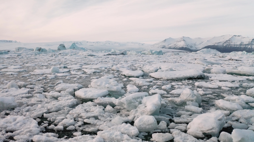 Aerial view of the J kuls rl n glacial lagoon and floating icebergs. The beginning of spring in Iceland