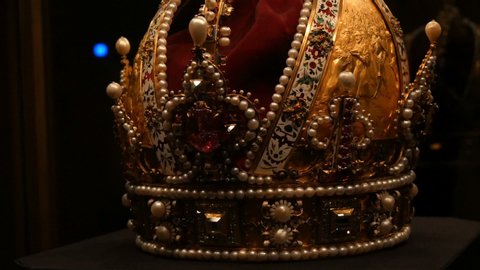Real old vintage antique royal crown for official coronations, decorated with gold, diamonds, rubies, sapphires and other precious materials