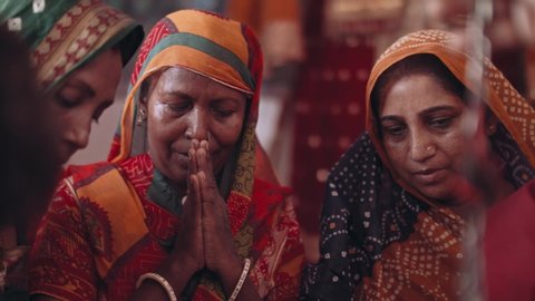 Group of Hindu minority woman praying to their God in Karachi, Pakistan – unique cinematic shot. Karachi, Pakistan. 6th Dec 2019