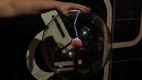 Plasma globe, plasma lamp, plasma ball,orb. Glass container filled with a mixture of various noble gases with a high voltage electrode in the center. - Powered by Shutterstock - Get 15% off with code: PIKWIZARD15