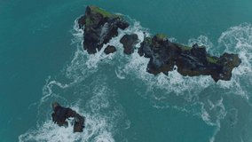 Aerial drone view footage rock in black sand beach Vik Iceland Reynisfjara Beach